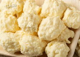 Kokoso drožlių skaniukai, aplieti baltu šokoladu, 1 kg