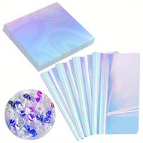 100 vnt. celofano lakštų, mėlyna fluorescencinė pakuotė, tinka vaivorykštinės plėvelės rankdarbiams, holografinis celofano popierius