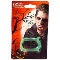 Švytintis vampyro dantis tamsoje.