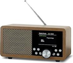 "Dynavox DBT600 DAB+" radijas, nešiojamas skaitmeninis FM radijas, idealiai tinka kaip virtuvės radijas, vonios kambario radijas, biuro radijas, žadintuvas, BT, TFT ekranas, maitinimas iš tinklo arba akumuliatoriumi, USB/Micro SD grotuvas, medžio dekoras
