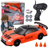 Sportinis automobilis R/C 1:24 su nuotolinio valdymo pultu ir keičiamais ratais, oranžinis