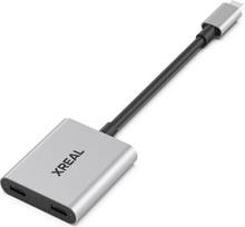 "XREAL Hub", "Power and Play" adapteris, kad galėtumėte įkrauti AR akinius ir tuo pat metu įkrauti šaltinio įrenginį, pvz., "Steam Deck", "ROG Ally", "Switch", "iPhone 15" arba "Android" telefoną. 45 W greitasis įkrovimas