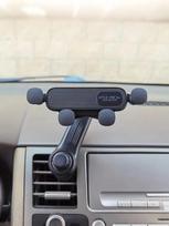 New Gravity-Sensing Car Air Vent Phone Holder - 4-Point Anti-Slip Clamp + Fan Blade Stabilizer, Universal for All Phones juoda