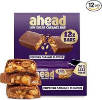 "ahead Popcorn Caramel", 12 x 38 g šokolado batonėlių, 1,9 g cukraus viename batonėlyje, traškūs lazdyno riešutai ir karamelės skonis, mažai angliavandenių turintys saldumynai be palmių aliejaus