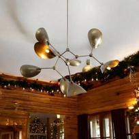 A modern mid-century stilnovo style chandelier with 8-arm, curved disc shades made from rough-hewn slate