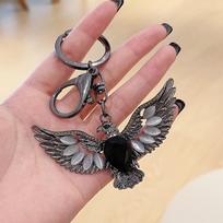 Retro Eagle Wings Cat's Eye Stone Keychain Pendant ginklo juodos spalvos