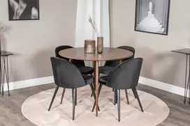 Venture Design Valgomojo komplektas Plaza apvalus stalas 100 cm riešuto viršus riešuto kojos juodos aksominės valgomojo kėdės 100 cm riešutas juoda