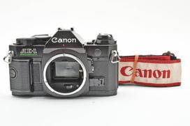[Naudotas] Canon AE-1 Program 35mm SLR juostinis fotoaparatas #7650 juoda