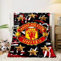 A Manchester United logo surrounded by gold stars on a red-black pattern. for all seasons blanket lunch break throw gift 80cm x 120cm
