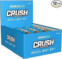 "BioTechUSA Crush Bar" batonėlis su dideliu kiekiu baltymų, su traškia šokolado glazūra ir be pridėtinio cukraus, 12 x 64 g, irisinis kokosas
