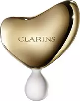 „Clarins“ brangusis auksinis veido masažo akmuo