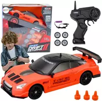 Sportinis automobilis R/C 1:24 su nuotolinio valdymo pultu ir keičiamais ratais, oranžinis