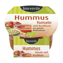 Humusas su saulėje džiovintais pomidorais ir bazilikais