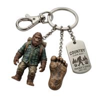 Resin Bigfoot Tracker Adventure Keychain Unique Bigfoot Figurine Keyring with Footprint and Metal Tag for Outdoor Enthusiasts Hikers and Legend Fans balta