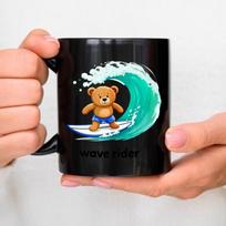 Ceramic mug with black bear surfing on waves with the text  Wave Rider  for coffee, tea or water at home, in the office or while juoda
