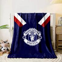 A Manchester United crest on a dark blue background with red accents. for all seasons blanket lunch break throw gift 80cm x 120cm