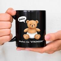 Ceramic mug, black teddy bear in a diaper, complete with a pain dialog box and  Make me stronger  text, perfect for coffee, tea juoda