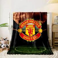 A red and yellow crest with  Manchester United  text and symbolic imagery. for all seasons blanket lunch break throw gift 80cm x 120cm