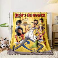 A quirky family holding condiments and a burger on a vibrant yellow background. for all seasons blanket lunch break throw gift 80cm x 120cm