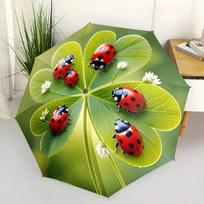A Compact Folding Umbrella Featuring Ladybugs on a Backdrop of Green Leaves, Perfect for Gifting on Any Occasion.