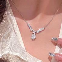 Women's Angel Wings Necklace: Luxurious Gemstone Sparkle, Retro Collarbone Chain with Pigeon Egg Style.