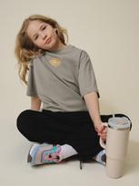 4F T-shirt loose su spauda mergaitėms - smėlio 122/128 (6-8 metai)