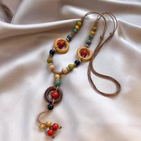 Vintage Bohemian style ceramic beads, long braided rope, pendant, necklace, female niche design, light luxury and high-end necklace.