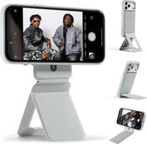 "MOFT x Tombogo" trikojis, skirtas "iPhone 17/16/15/14/14/13/12" serijai, "Snap Invisible Portable Lightweight Mobile Phone Tripod Stand" su 3 režimais, skirtas savarankiškam vaizdo įrašymui, makro fotografijai, vaizdo skambučiams, cemento pilkos spalvos