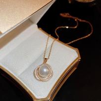 Stainless steel zircon surround pearl pendant necklace stud earrings set French retro light luxury collarbone chain fashion item