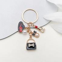 Elegant Black Drip Oil Bow Handbag & Pearl Top Hat Keychain Accessories