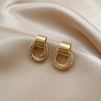 Retro Gold Metal Earrings with Multiple Small Round Studs for… More auksas