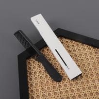 Black Disposable Fine-Tooth Plastic Comb in White Box for Hotel, Guest, Travel, and Portable Use.