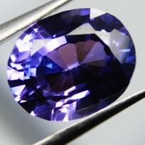Natūralus violetinis tanzanitas 7 ct Ovalo formos laisvas brangakmenis dovanai 12 mm approx violetinė
