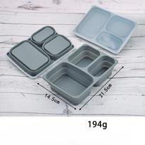 Inner-wrapped steel strip silicone folding lunch box for food preservation and storage. Microwave oven compatible. >8 inch tamsiai pilka spalva