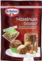 „Dr. Oetker“ lazdyno riešutų glazūra – su traškiais vaflių gabalėliais, švelniai tirpstanti, kakavos turinti lazdyno riešutų glazūra suteikia papildomą traškumo dozę tortams, pyragams ir desertams.