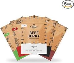 „Grizzly Foods“ • 5 rūšių džiovintos jautienos degustacinis rinkinys (5 x 100 g) • Džiovintos mėsos baltyminiai užkandžiai • Jautiena iš Vokietijos • Baltyminis užkandis, skirtas sporto salėje, fitneso užsiėmimuose, lauke ir biure