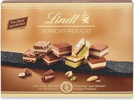 „Lindt“ šokoladiniai saldainiai su sluoksniais | 125 g | Dovanų dėžutė su 12 rankomis sluoksniais sudėtais migdolų, lazdyno riešutų ir pistacijų nuga saldainiais | Šokoladinė dovana | Šokoladinė dovana