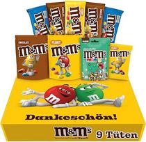 „M&M'S Dankeschön“ užkandžių rinkinys I Žemės riešutai, traškūs, šokoladas, šokoladiniai „Minis“ I 4 rūšys I 9 pakuotės I 724 g I Dovanų dėžutė su saldainiais
