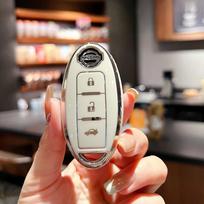 Tinka Nissan Qijun raktų komplektui Viską apimantis Tule automobilio sagtis Loulan Teana Bluebird Xuanyi aukštos klasės apsauginis sagties dėklas