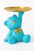 Teddy bear on a turquoise tray