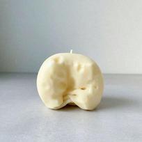Pale yellow cheese squishy toy with coconut cream filling, made of soft dough texture. Silent squeeze design for stress relief,