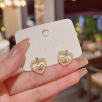 High-End S925 Silver Pearl Bow Earrings with Hollow Heart Design