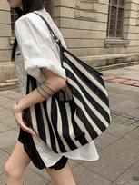 Niche Korean version of large-capacity woven bag tote bag summer new hollow lazy wind shoulder armpit bag beach bag