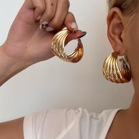 European & American Retro Metal Twisted Hoop Earrings for Women - Bold, Versatile, and Stylish Accessory.