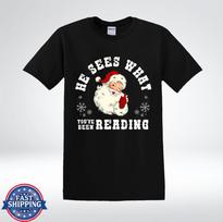 Funny Santa He Sees What You’ve Been Reading Christmas Humor T-Shirt 2XL