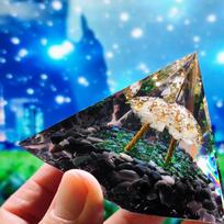 Handmade epoxy pyramid decorated with obsidian wood