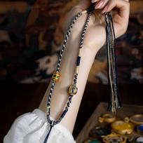 Tibetan Style Woven Thangka Pendant Necklace with Buddha Amulet and Six-Syllable Mantra. brown