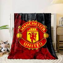 A red and yellow crest with  Manchester United  text and iconic elements. for all seasons blanket lunch break throw gift 80cm x 120cm black