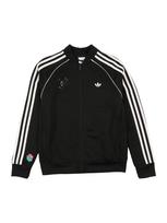 ADIDAS ORIGINALS Demisezoninė striukė 'BRAWL STARS SUPERSTAR LOOSE TRACK' žalia / rožinė / juoda / balta