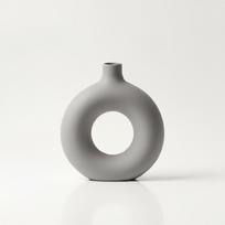 Decorative round vase with a hole, gray, for flowers, minimalist